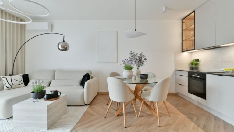 Photo of Modern Open-Plan Living Room with Japandi Style, White Sofa, Led Ring Chandelier, Herringbone Wood Flooring and Minimalist Fitted Kitchen