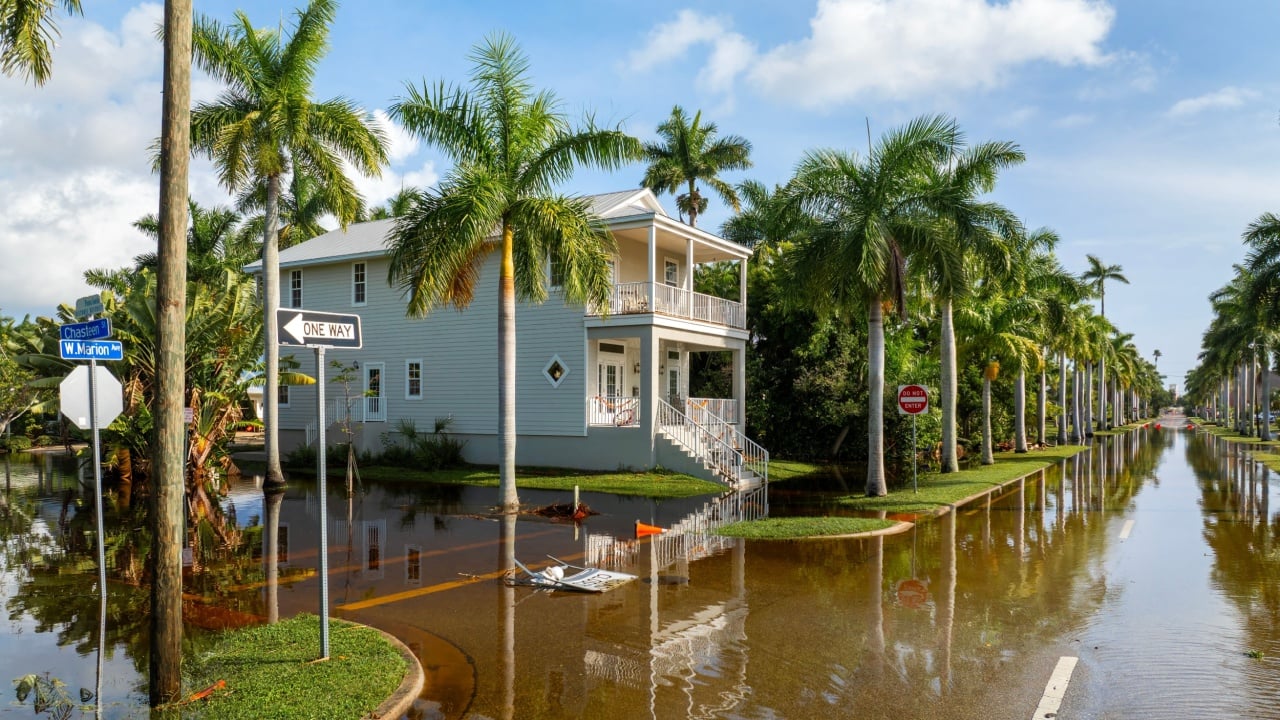 Flooding in Florida caused by tropical storm from hurricane rainfall. Suburb houses in residential community surrounded by flood waters. Aftermath of natural disaster