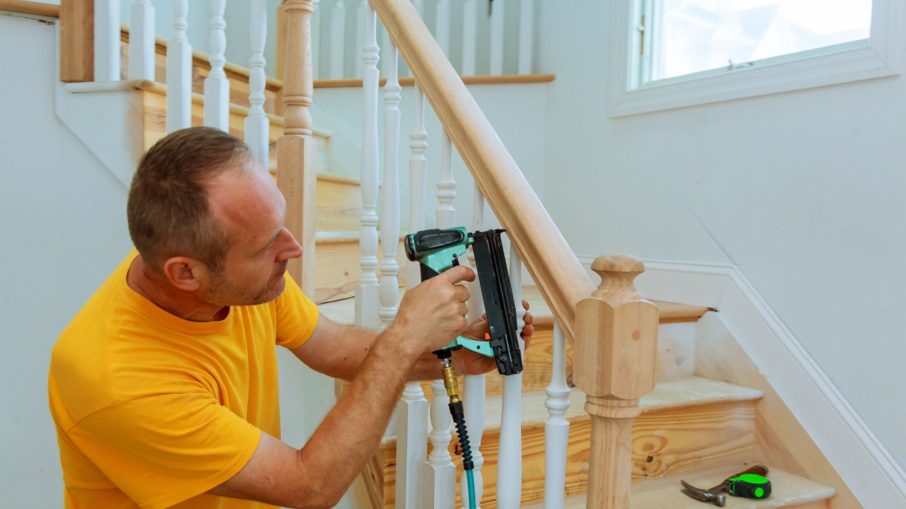 Installation wizard for wooden railing for stairs Wooden planks swinging around pole. Success business concept. Abstract spiral stairway staircase installation.