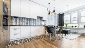 Modern small room with kitchen area and wooden floor