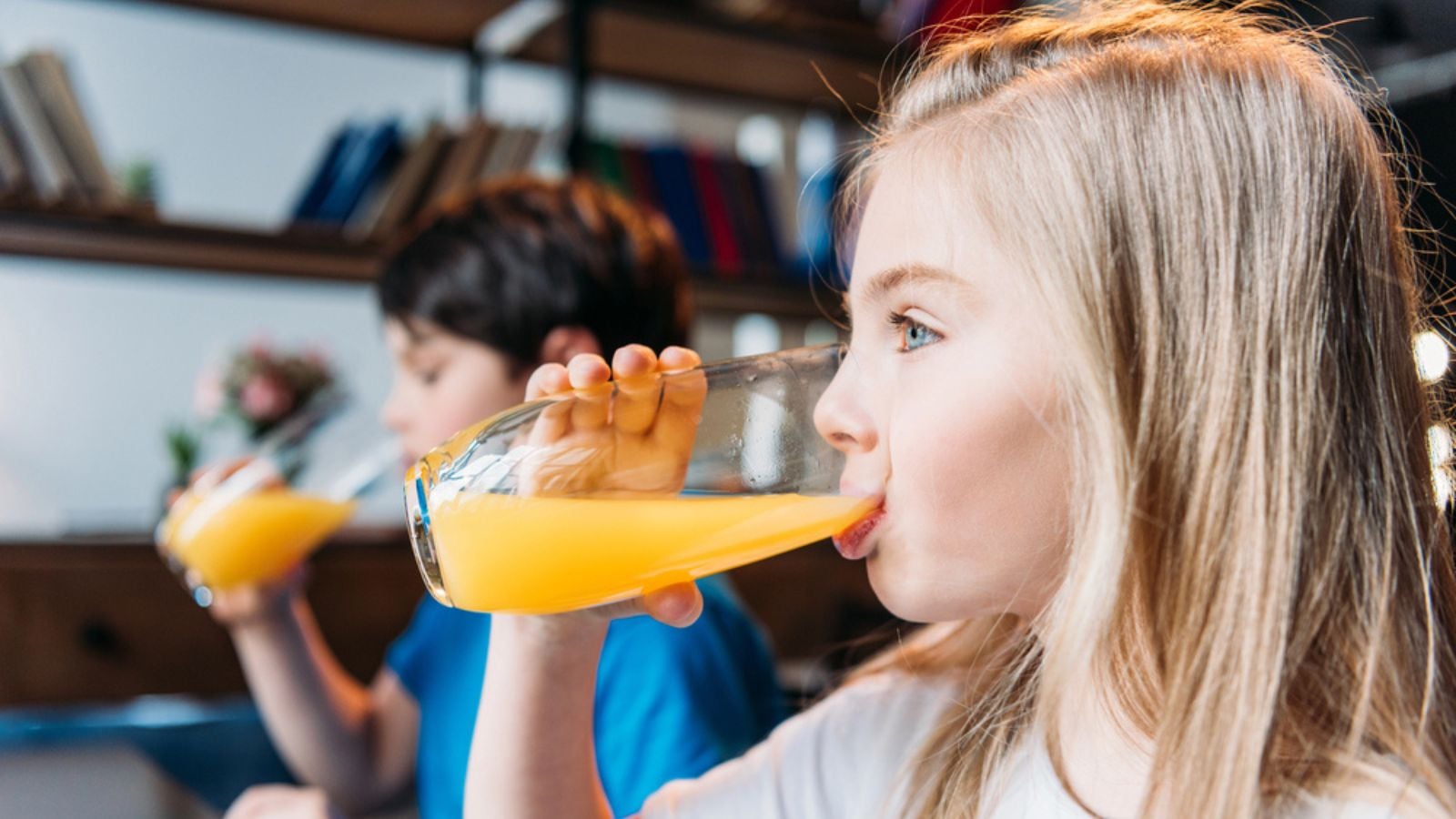 Sweet colorful jelly beans in scoop on white table.