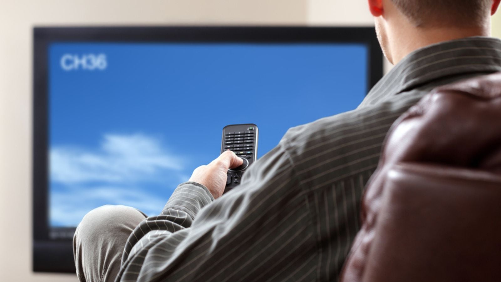 Man in classic grey suit with briefcase outdoors