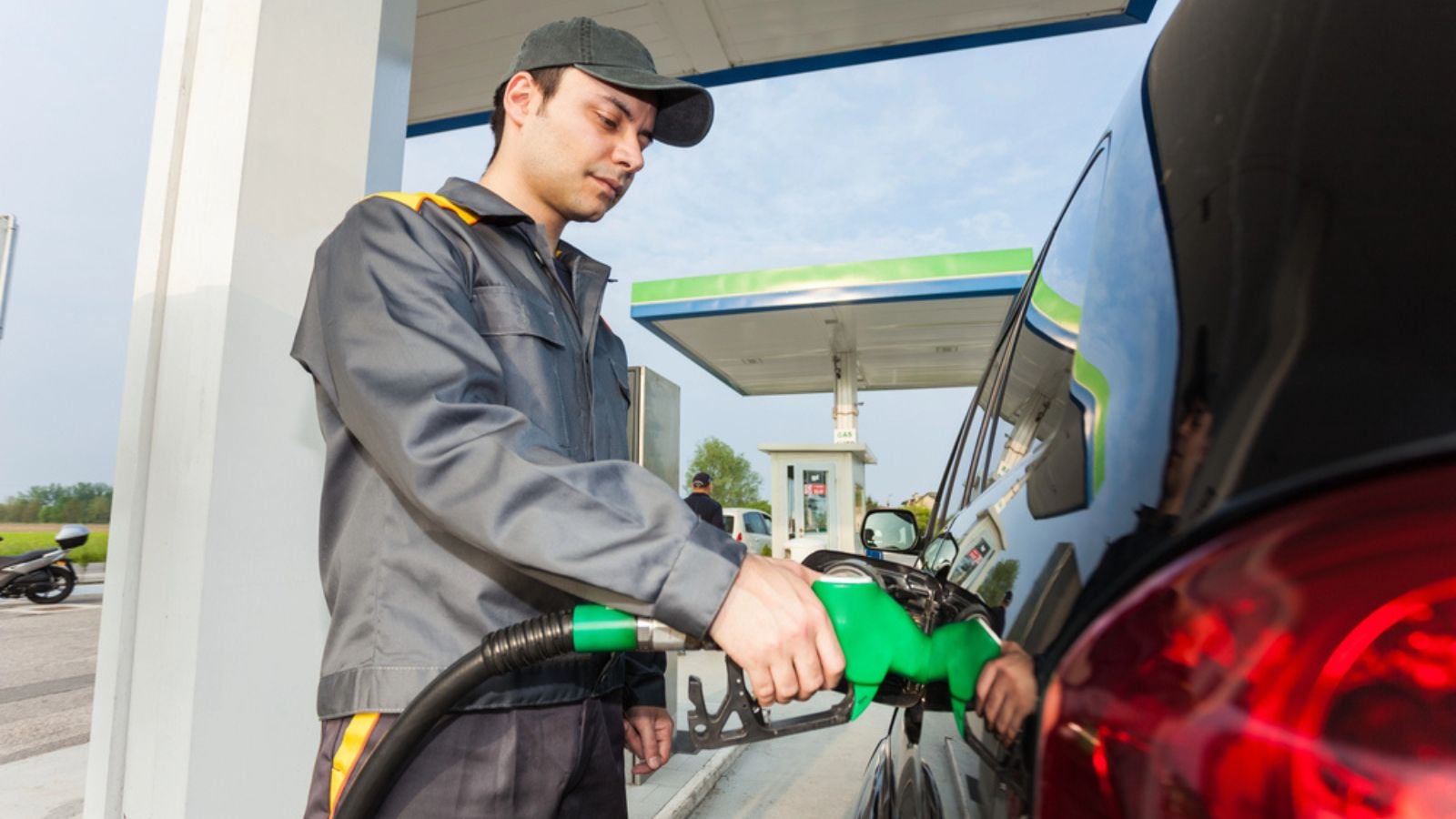 Man fueling up a car