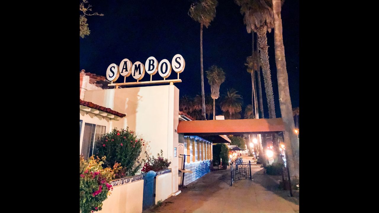 Santa Barbara, California USA - March 23, 2020: Sambos Restaurant, Defunct. Changed name to Chad's Cafe. Taken at night with large palm trees swaying in the wind. fyi: Sambos is racial slur