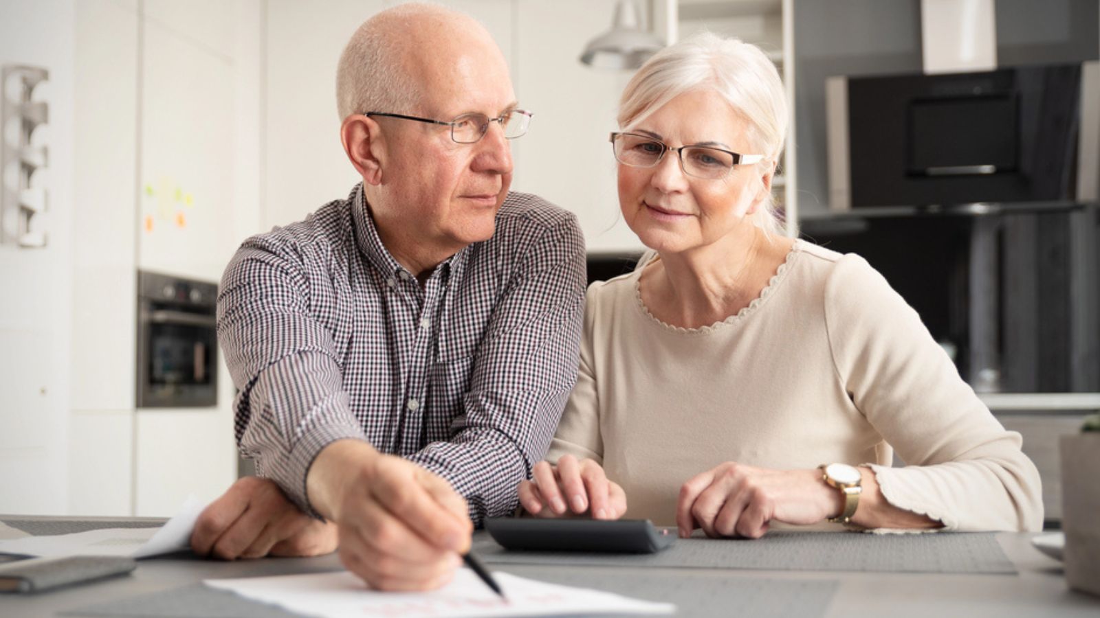 Senior couple discussing investment