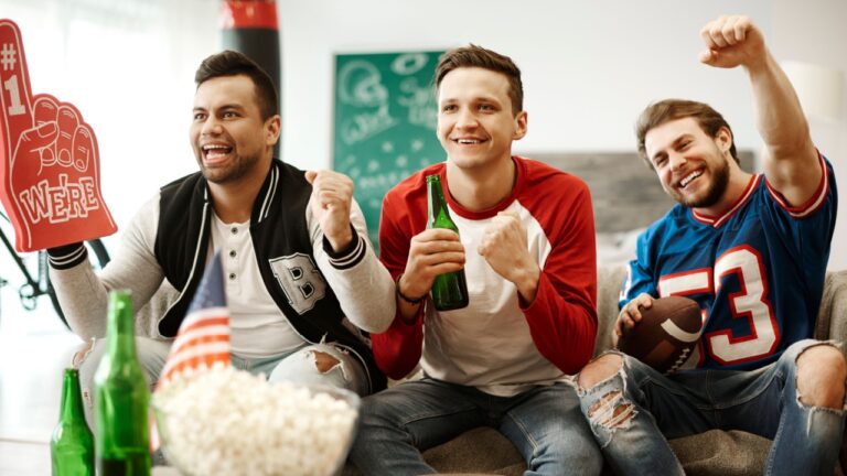 Football supporters cheering at home