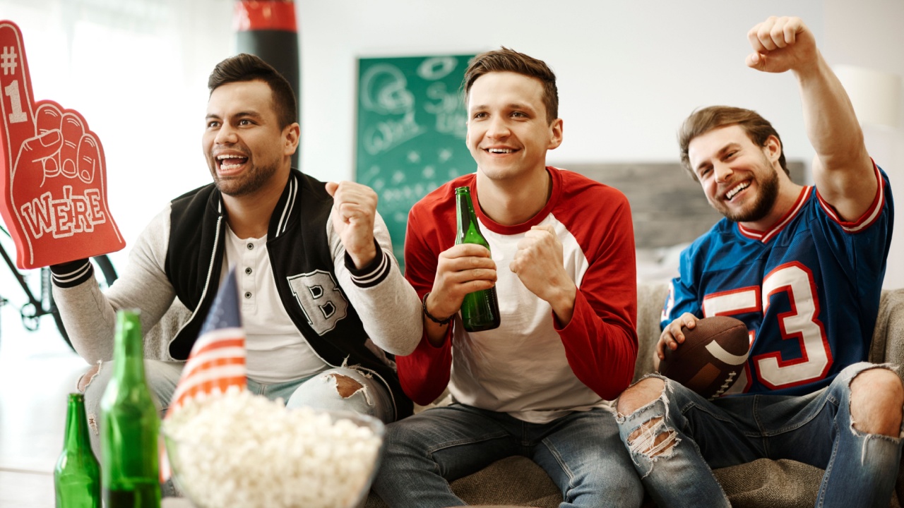 Football supporters cheering at home