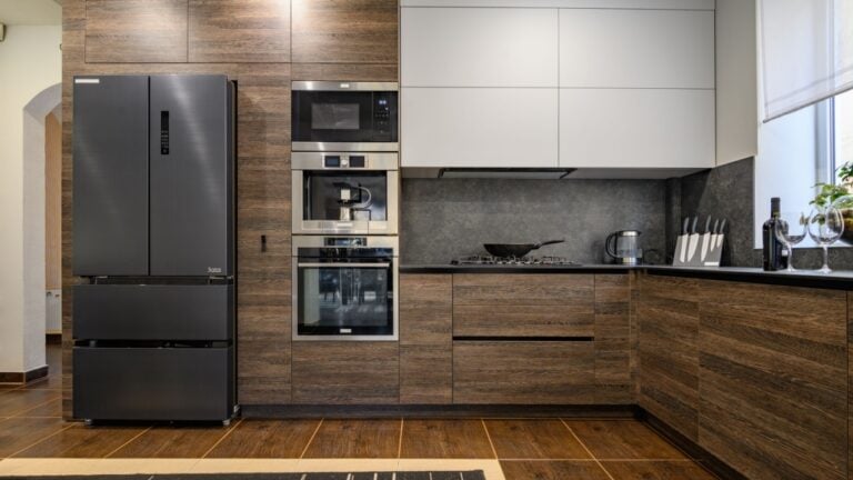 Modern large luxurious dark brown, gray and black cozy kitchen interior
