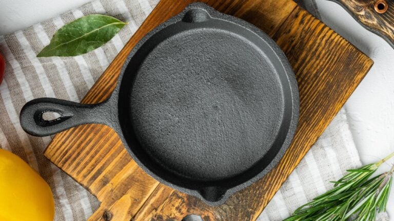 Empty frying cast iron pan background, kitchenware cooking concept set, on white stone surface, top view flat lay.