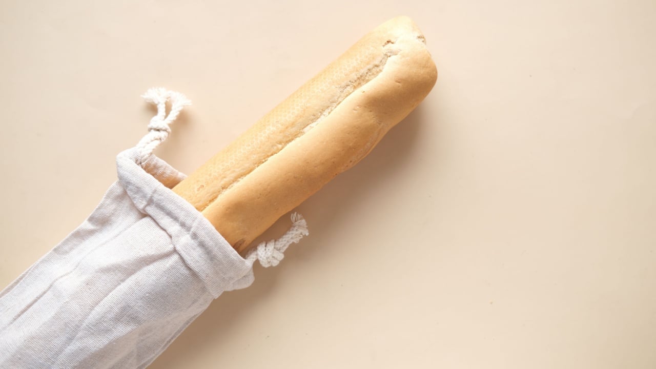  bag with bread on light color background..