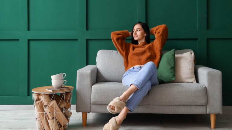 Beautiful young woman resting on couch at home