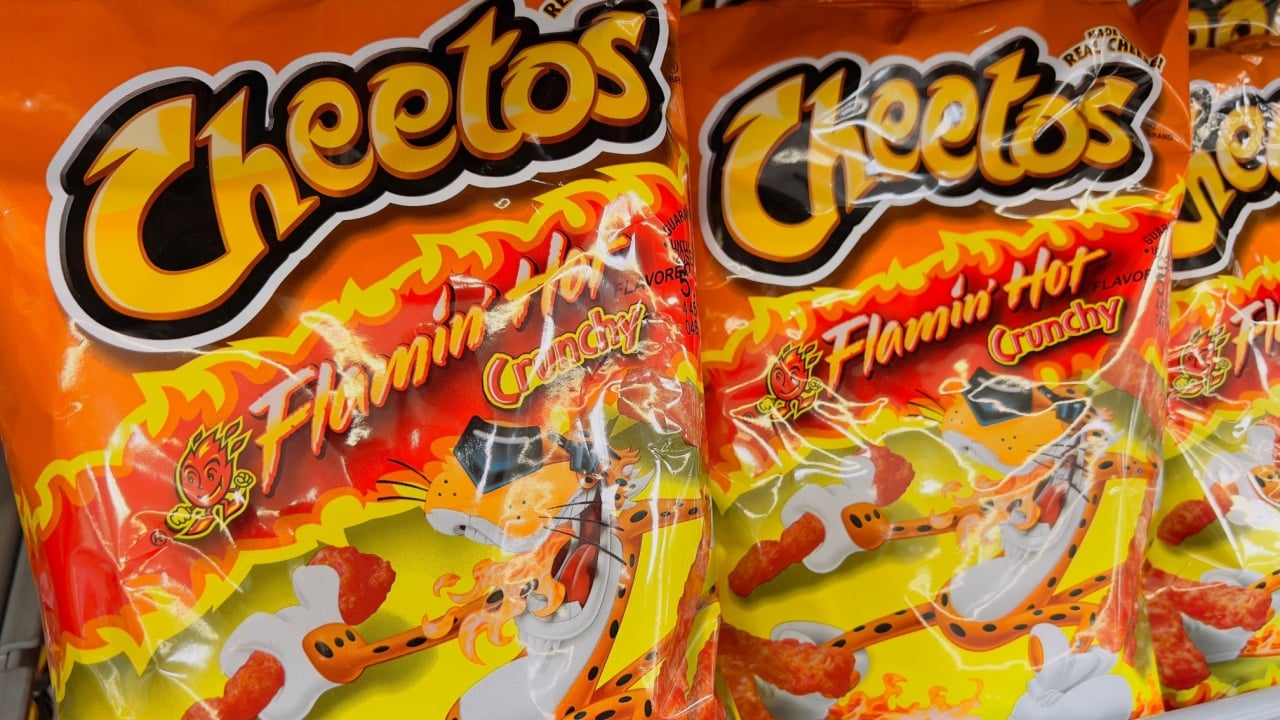 San Diego, CA - July 2, 2022: Bags of Cheetos Flaming Hot crunchy corn chips. 