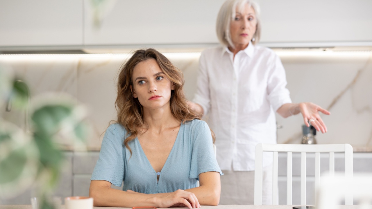 Elderly woman gets angry during quarrel with adult woman in kitchen