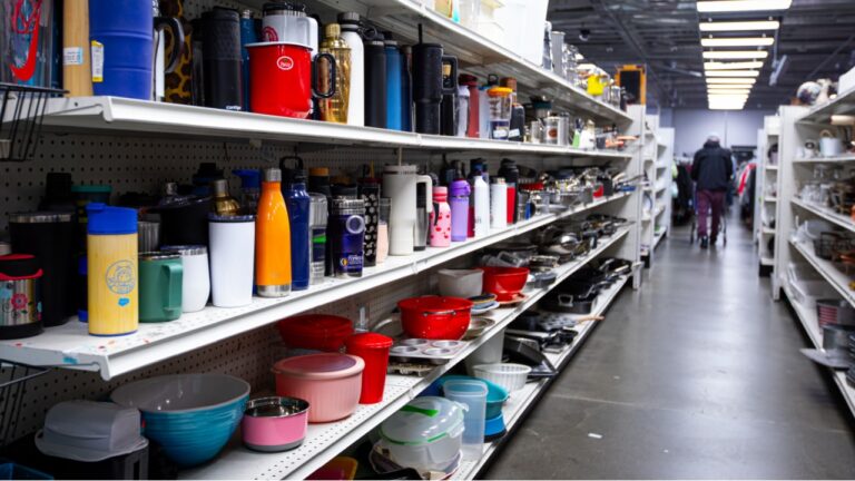 Mountain View, CA US - May 18, 2025: Full shelves of random used merchandise inside a local Goodwill second hand store. A thrift store indoors. Thrifting and reusing concept
