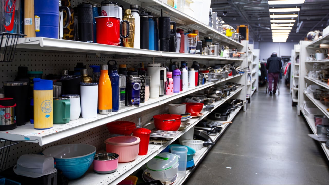 Mountain View, CA US - May 18, 2025: Full shelves of random used merchandise inside a local Goodwill second hand store. A thrift store indoors. Thrifting and reusing concept