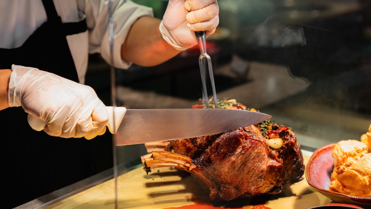 Chef Slicing Prime Rib Roast at Carving Station