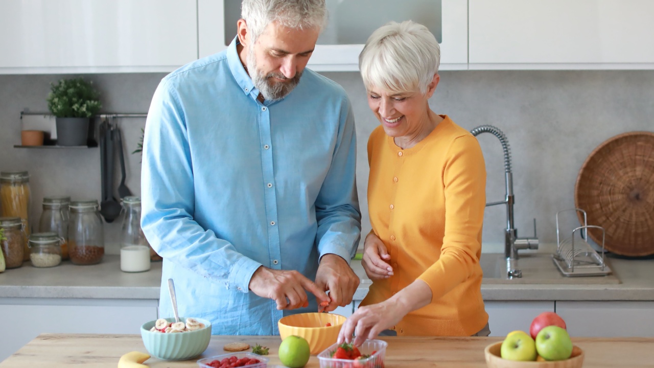 Portrait of a senior mature couple having a healthy breakfast in the morning at home