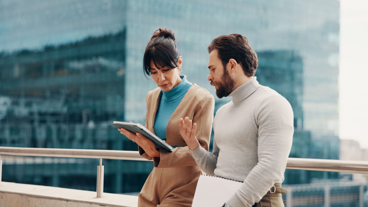 Meeting, balcony and business people on tablet for online project, finance review and proposal feedback. Team, collaboration and workers on tech for discussion, financial report and budget planning
