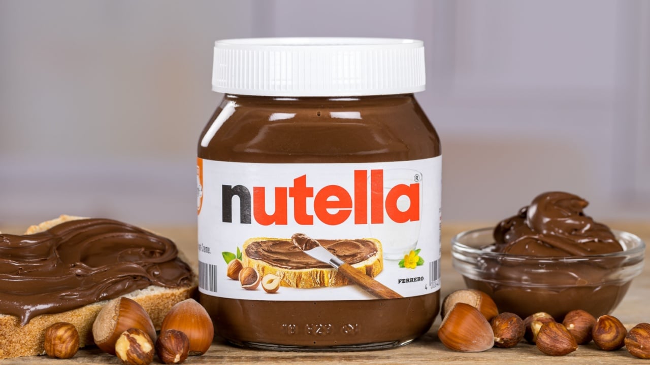 Stuttgart, Germany - September 26, 2025: Nutella hazelnut cocoa spread on bread 450g jar with company logo in Stuttgart, Germany.