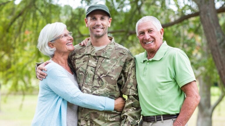 Soldier reunited with his parents on a sunny day