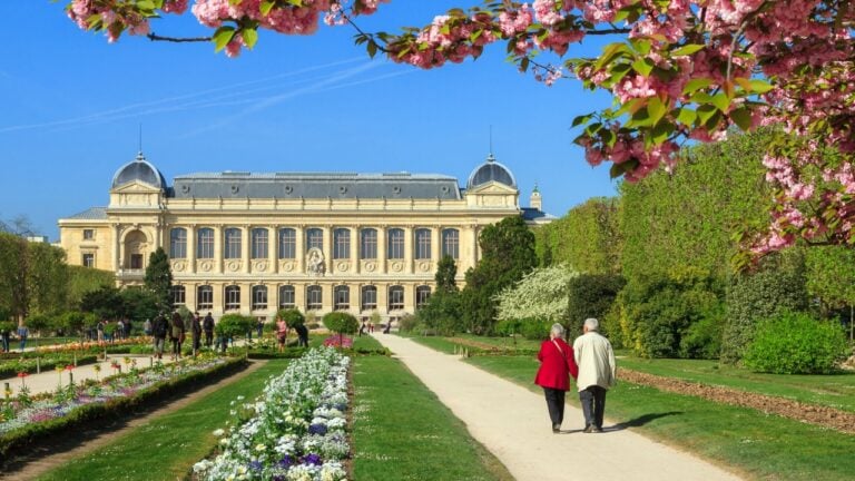 PARIS, FRANCE - APRIL 9, 2014: Elderly couple takes a spring stroll in the Jardin des Plantes in Paris, France, on April 9, 2014