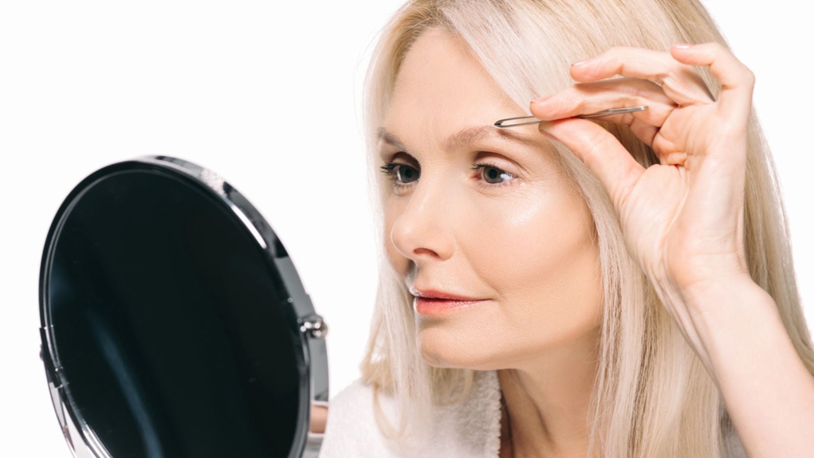 Woman making eyebrow correction