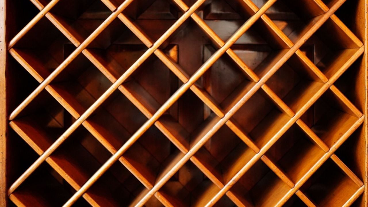 empty wooden wine cabinet. possession of alcohol in a bottle at a bar or at home.