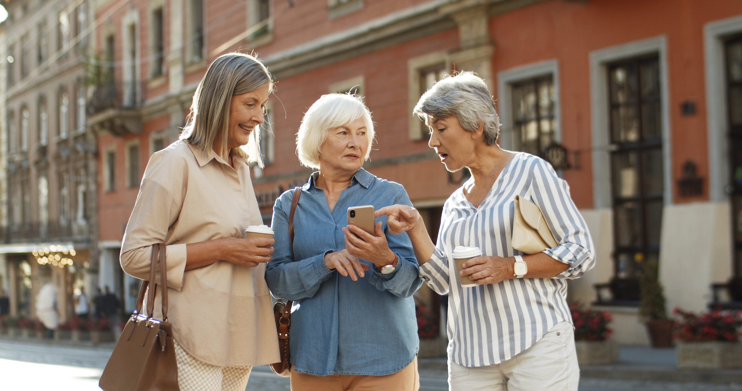 Three,Caucasian,Senior,Female,Friends,Standing,In,City,Center.,Good