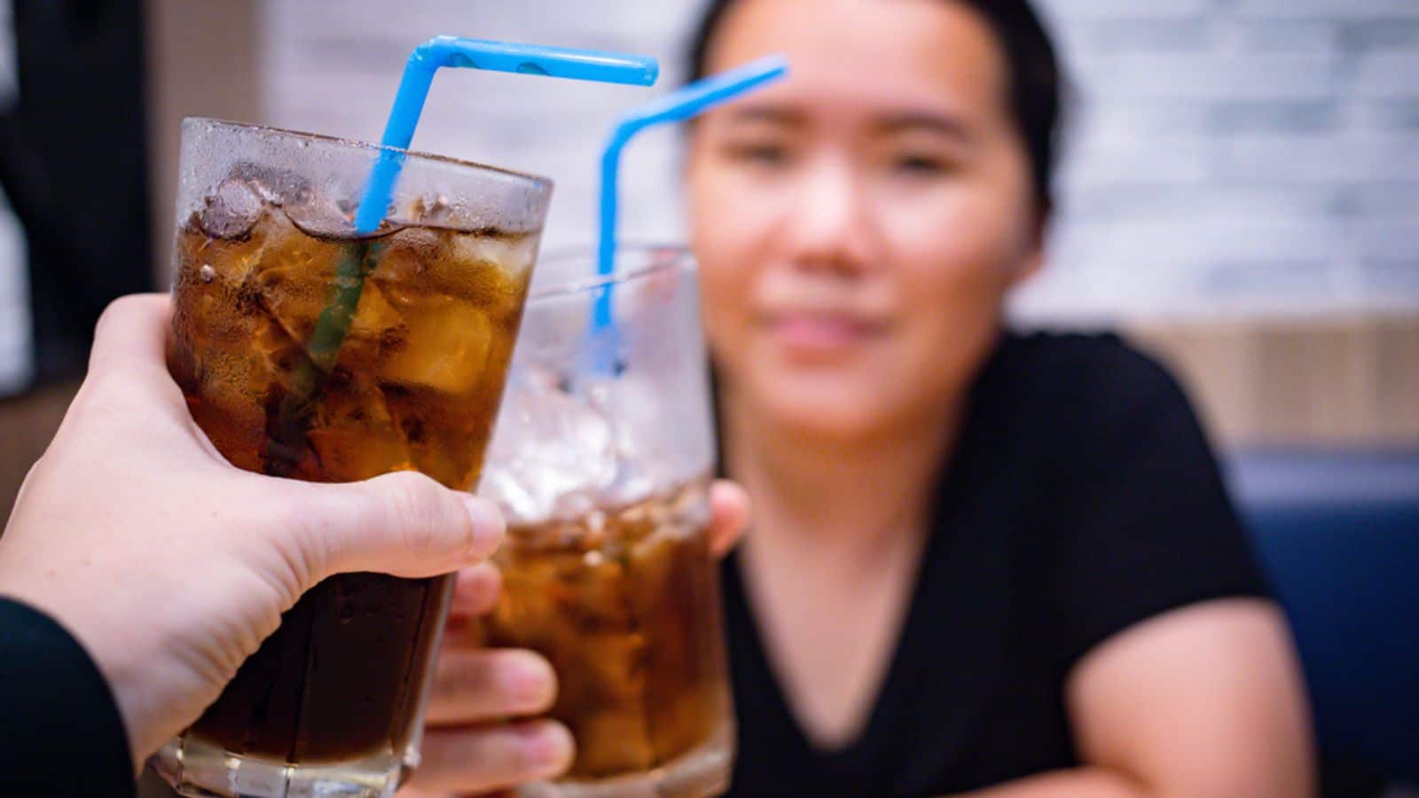 woman drinking soda pop