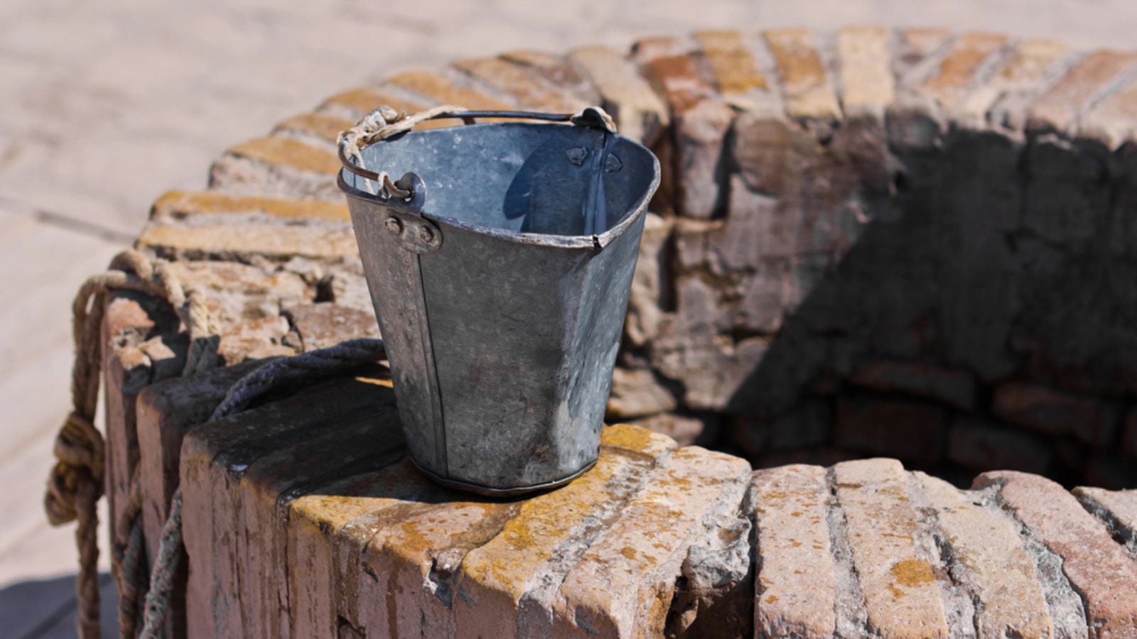 A water well with an old bucket