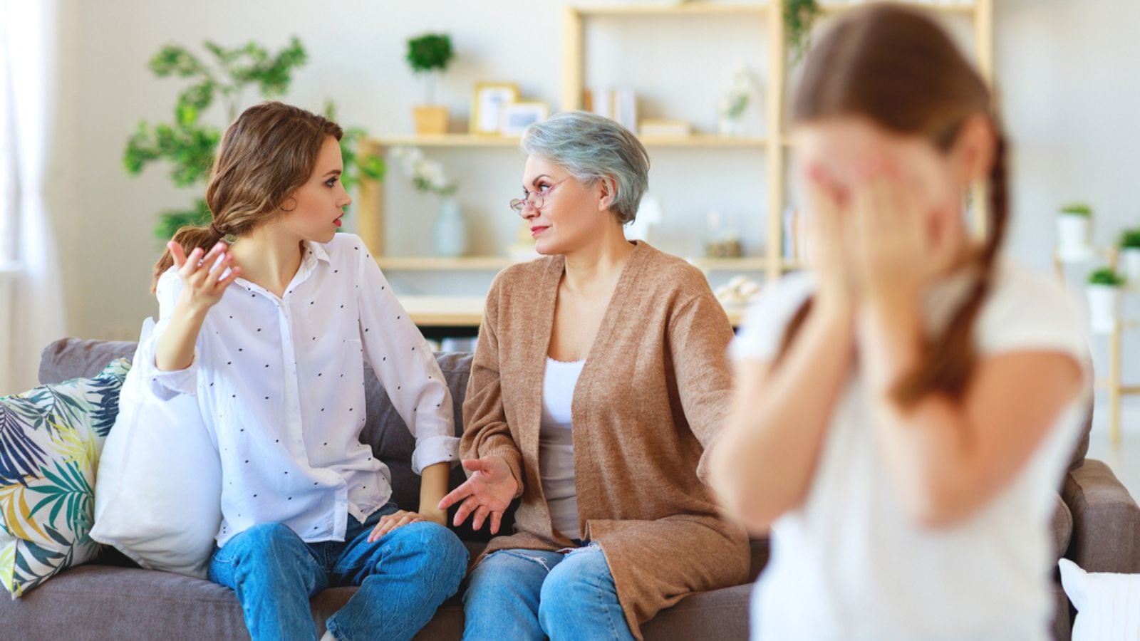 Conflict of family three generations angry mother and grandmother and crying granddaughter