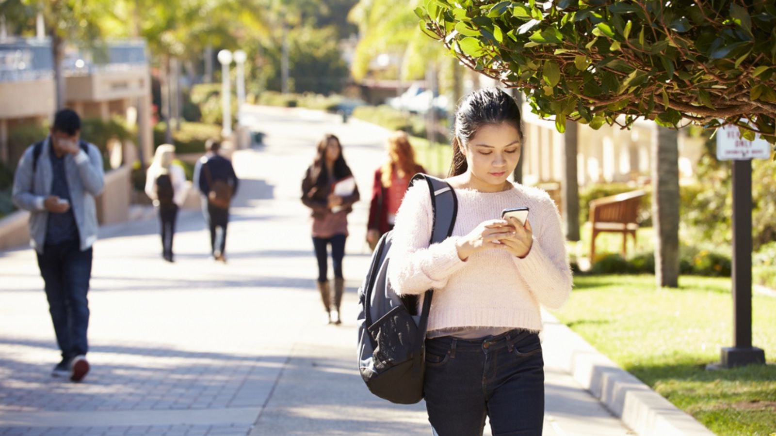 Female student using smartphone