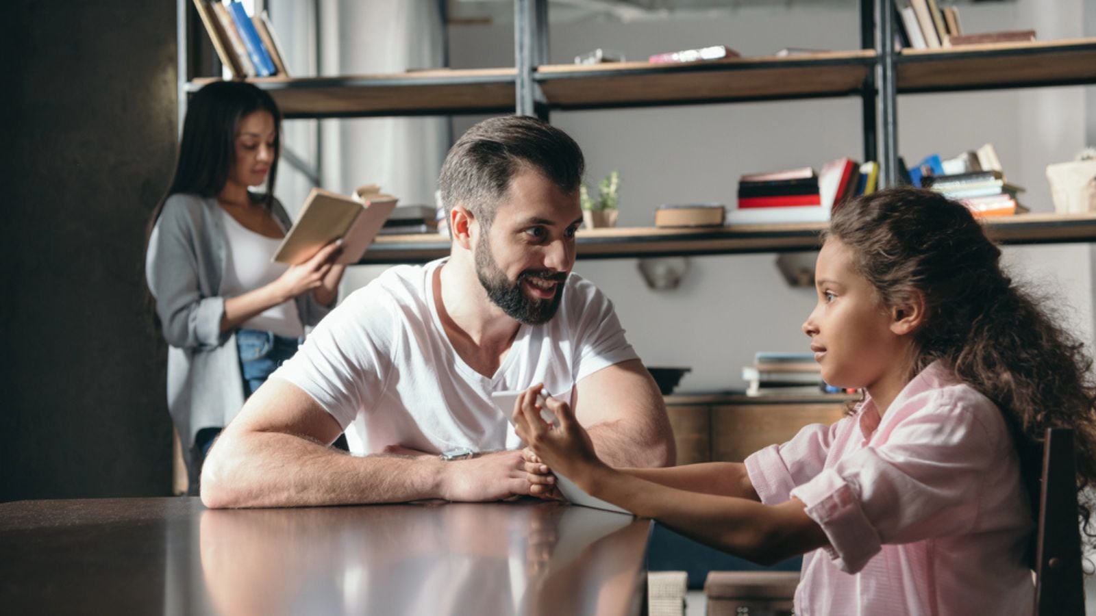 Pre-adolescent girl talking with father