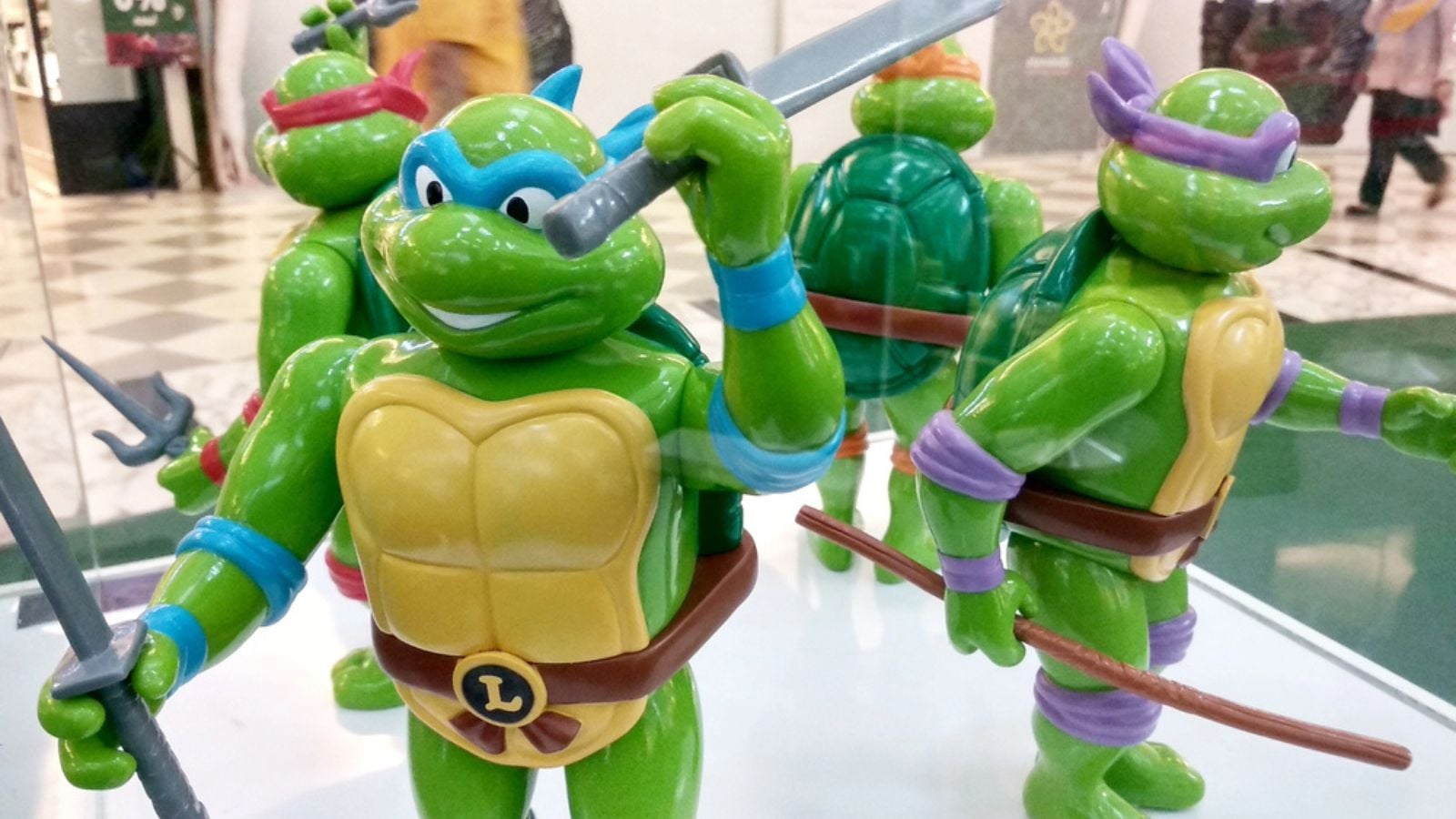 Selected focused of fictional action figure character TEENAGE MUTANT NINJA TURTLE. Displayed by collector on desk for public