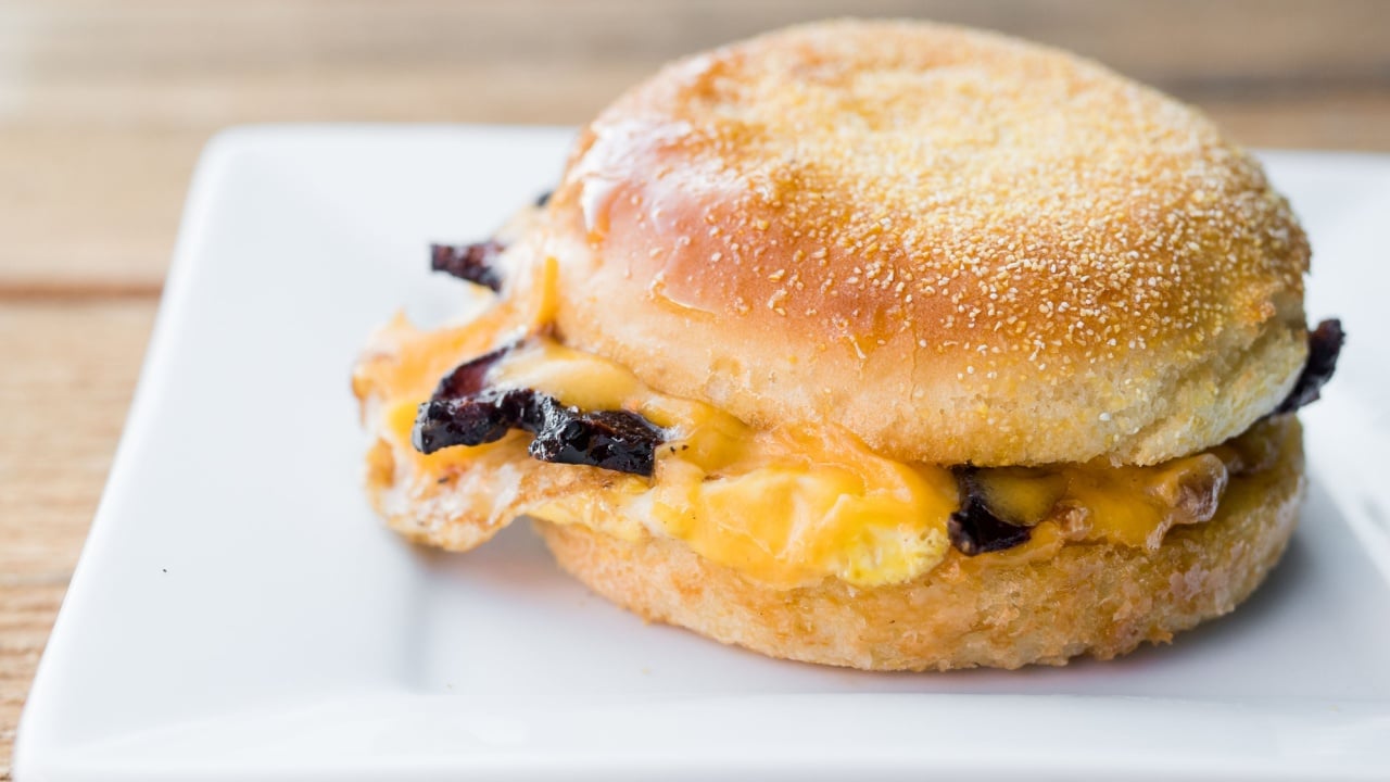 Gluten free breakfast sandwich with egg, cheese, and bacon.