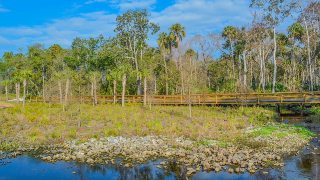 Stream flowing under walkway in Nocatee, St Johns County, Florida