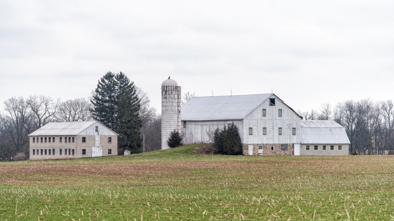 Mechanicsburg, USA - April 6, 2018: Rural Pennsylvania farm countryside mountain scenery in spring with house and silo farmhouse building