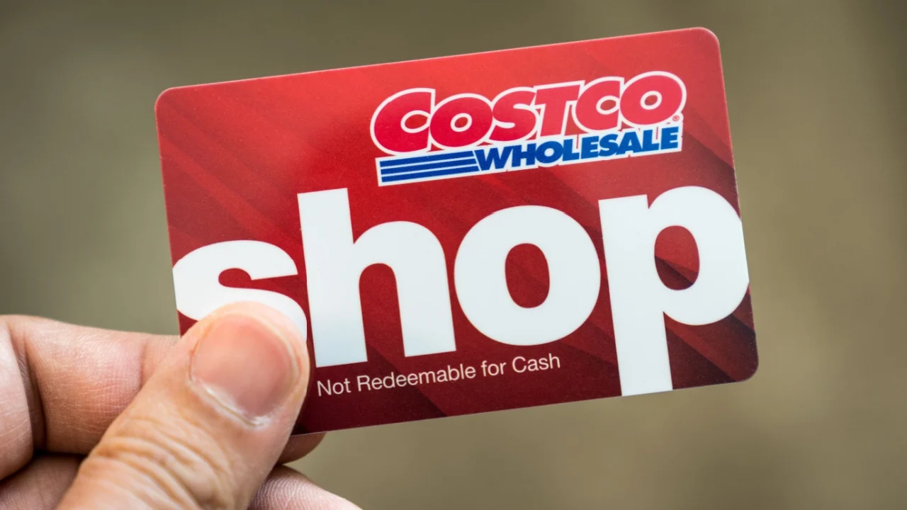 Detroit, USA - Sep 29, 2019 : Hand holding a Costco wholesale red color gift card isolated