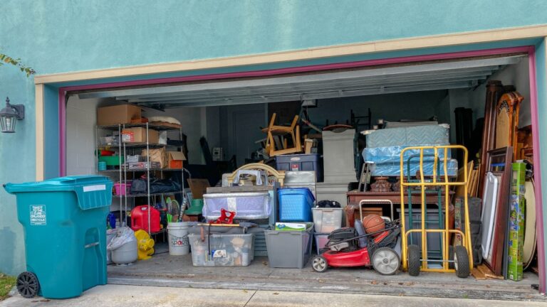 Orlando,FL/USA-11/13/19: An unorganized garage filled with a lot of stuff in a neighborhood.