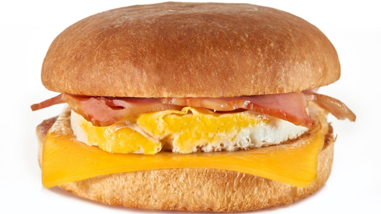 burger with fried egg on white background