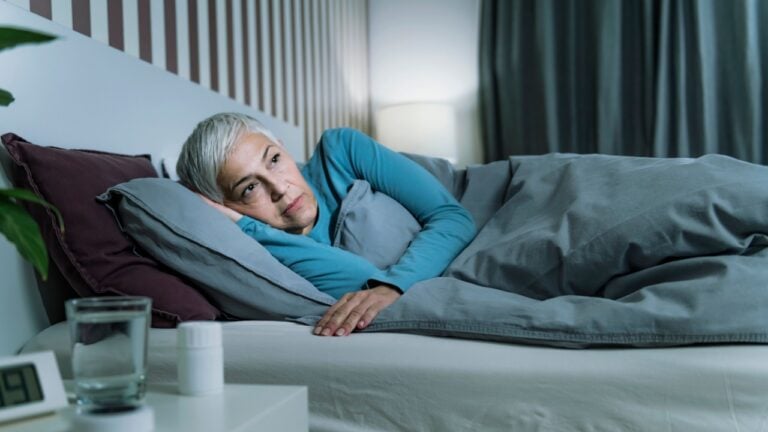 Insomnia - Sleep Disorder. Worried Senior Woman Suffering from Insomnia, Lying in Bed, Staying Awake Late at Night