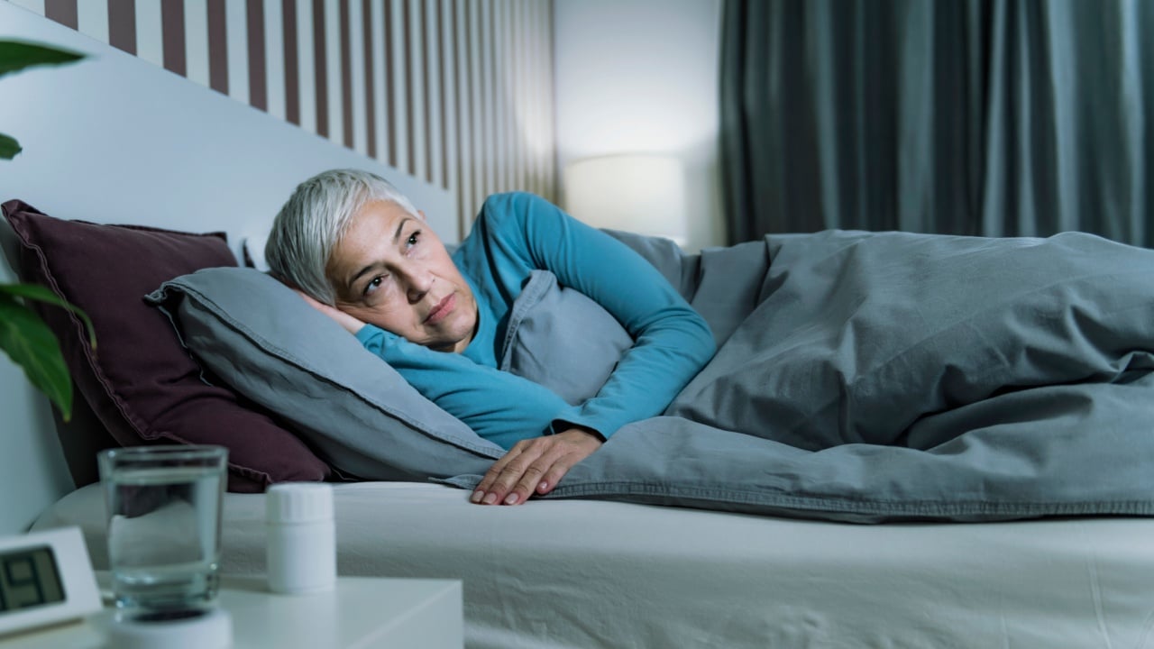 Insomnia - Sleep Disorder. Worried Senior Woman Suffering from Insomnia, Lying in Bed, Staying Awake Late at Night