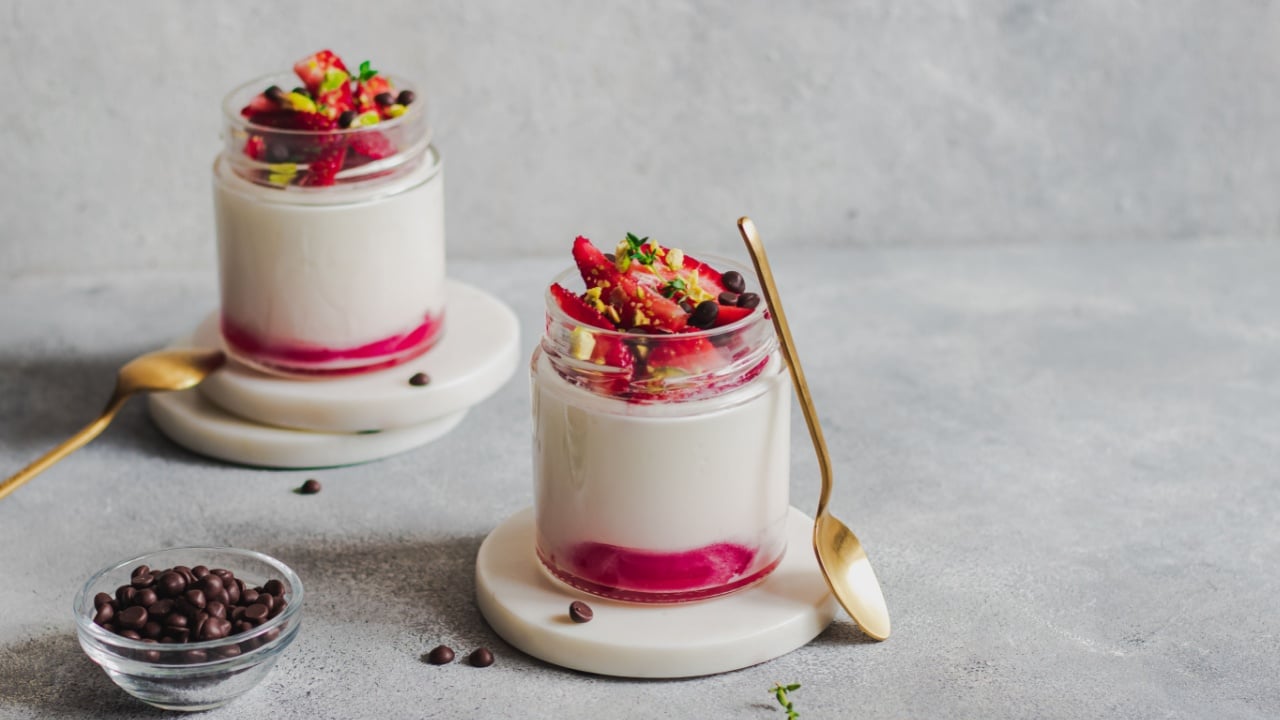 greek yogurt parfait with strawberries, pistachio nuts, thyme, chocolate. fitness desert