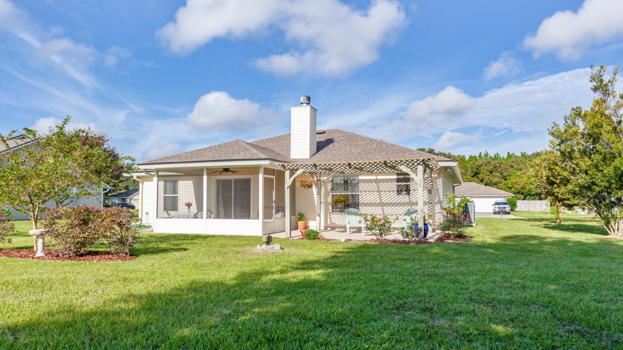 Yulee, Florida USA - June 24, 2021: Large backyard with a tree and lots of space for playing