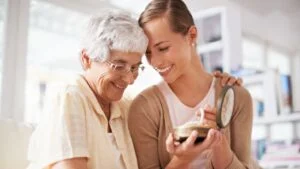 This is their family heirloom. Cropped shot of a senior woman giving her daughter a pearl necklace.