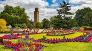 KEW, UK - JULY 15, 2019: People visit Kew Gardens in Greater London. Royal Botanic Gardens are designated as UNESCO World Heritage Site.