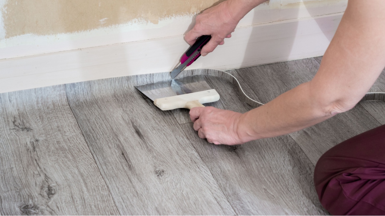Interior works. Installation of PVC flooring.