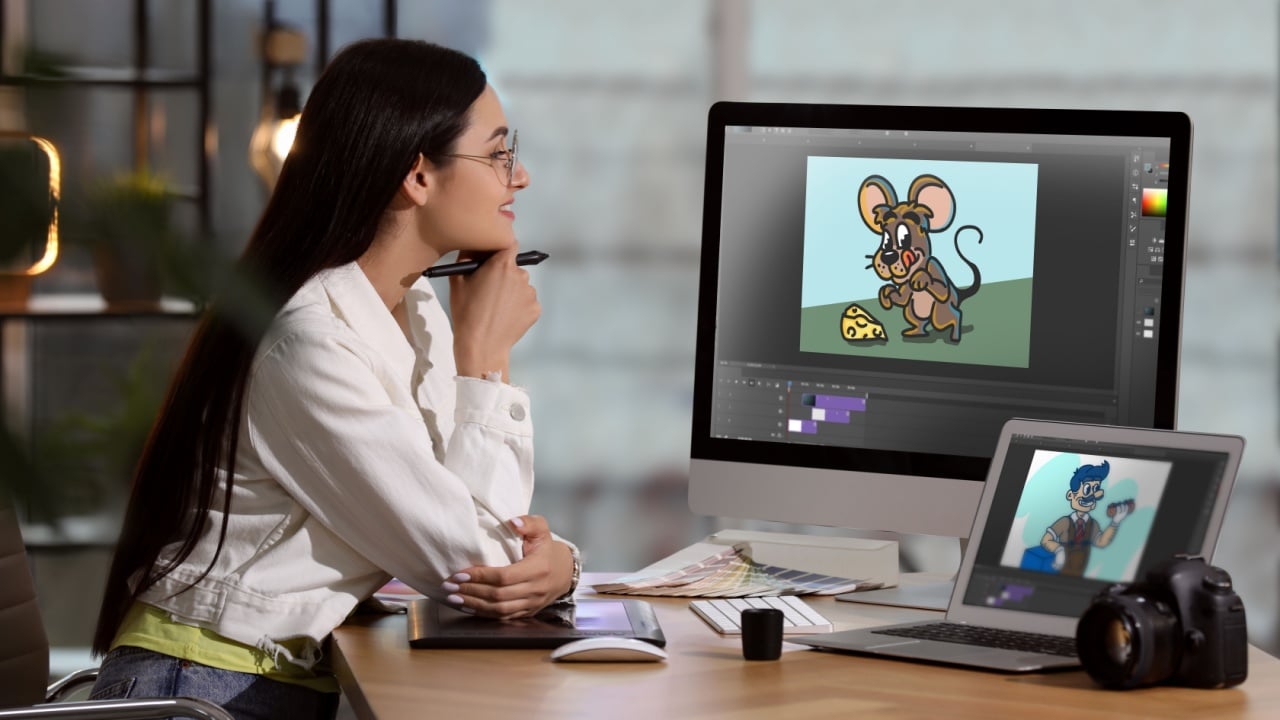 Animator working with computer and laptop. Illustrations on screens