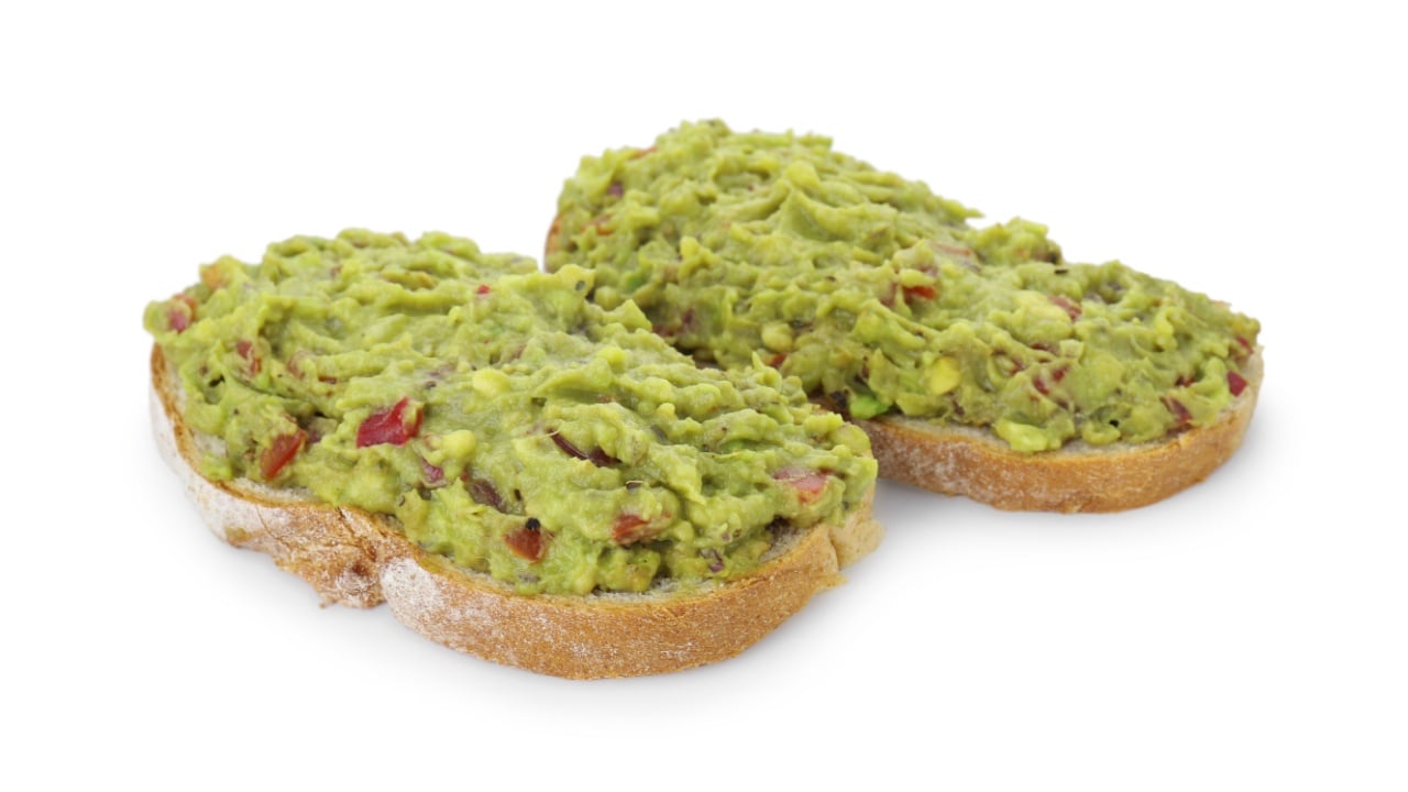 Delicious sandwiches with guacamole isolated on white