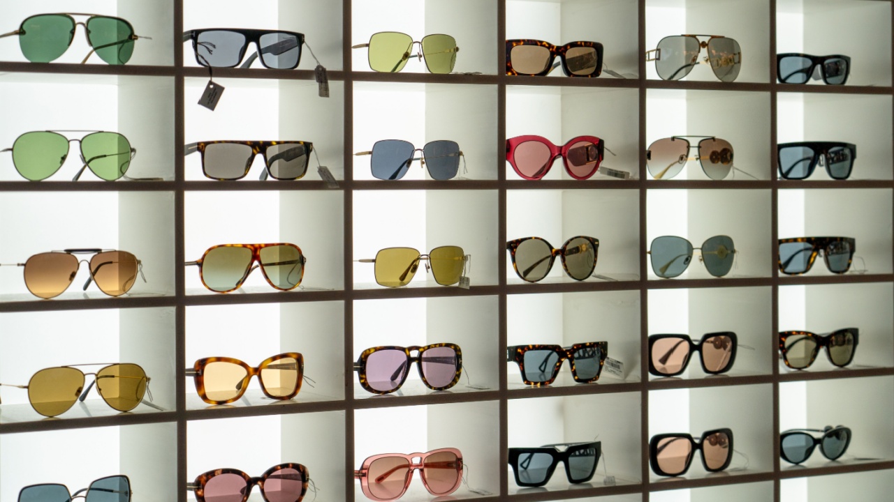 Display rack full of various sunglasses.